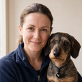 Megan Hale, CPDT-KA, with a dachshund wearing the stone